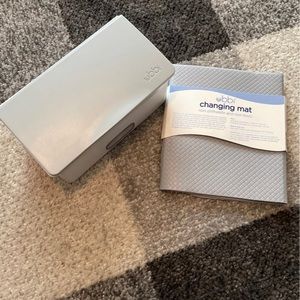 Ubbi wipe container and changing pad
